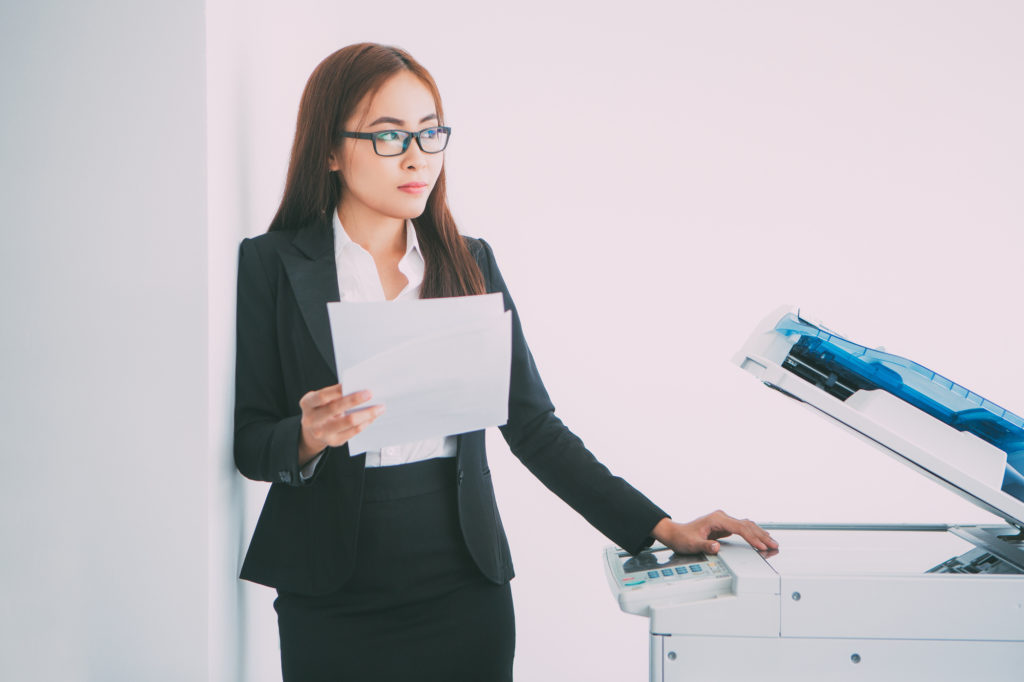 Woman is checking Pricing and Hidden Fees of office copy machine